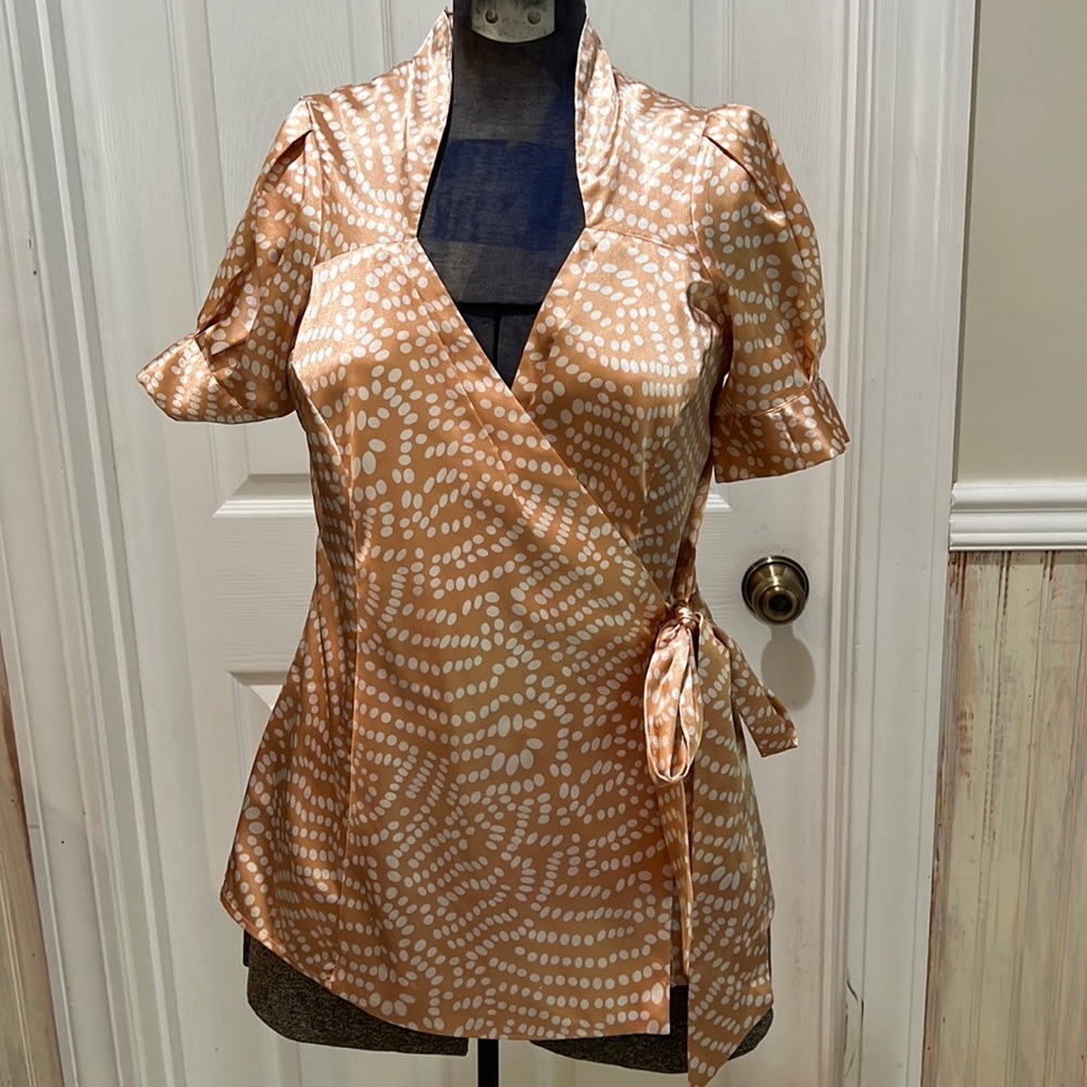 Peach and white polka dot satin blouse with side bow.